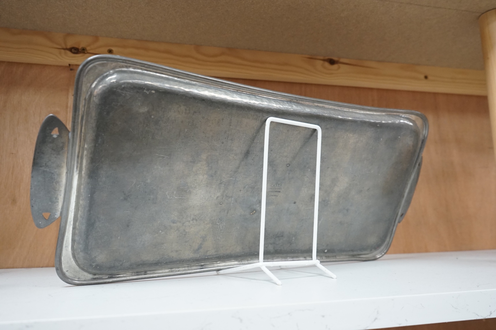 An Art Nouveau Liberty Tudric rectangular pewter tray, stamped and numbered 01671 to the base, 50cm wide